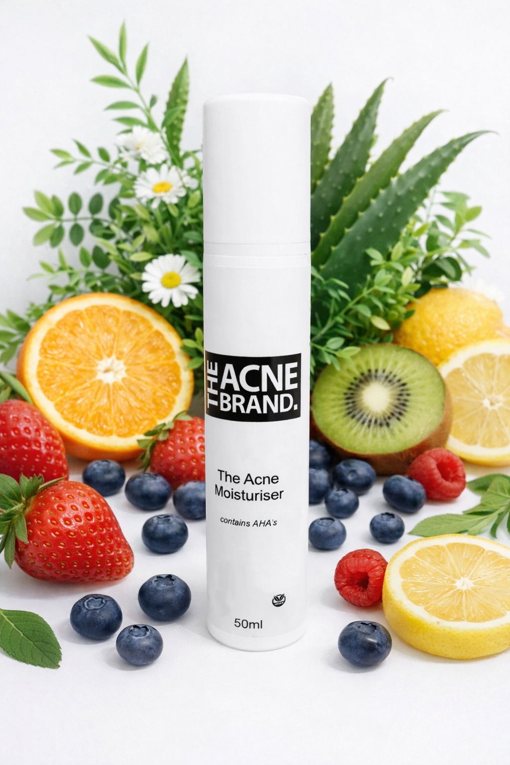 The Acne Serum from the plant-based acne skincare range on a marble surface with fruits and leaves.